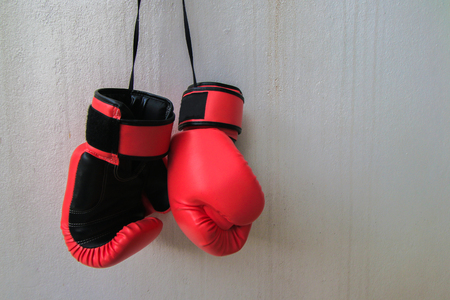 Red fighting gloves isolated on white backgroundの写真素材