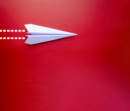 Close up paper airplane with isolated background and space use for texts or something displayの写真素材