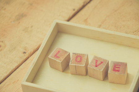 Close up LOVE text sign on wooden, Valentine's day concept.の写真素材