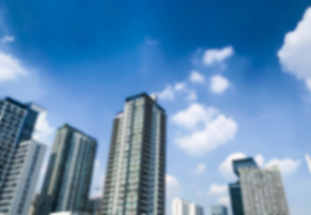 Blurred image of high building center of business with sky backgroundの写真素材