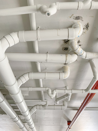 Close up many water pipe at the condominiumの写真素材
