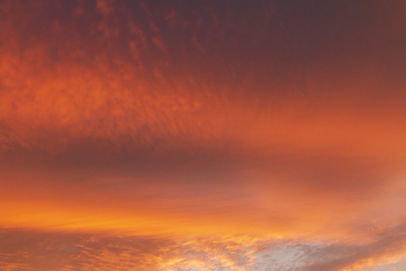 Colorful sunset sky with golden clousの写真素材