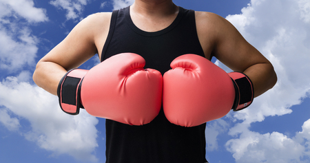Fighting man with boxing gloves isolated on white backgroundの写真素材