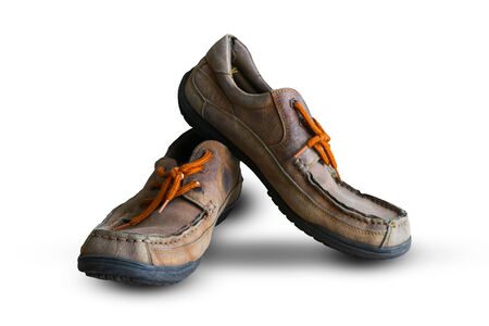 Old Brown leather shoes isolated on white backgroundの写真素材