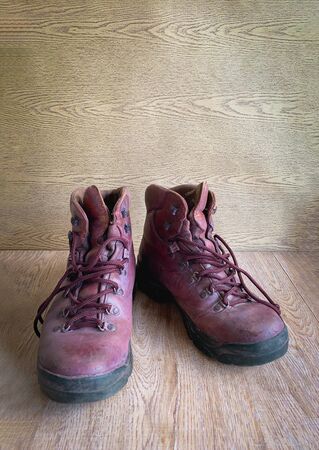 Close up retro old vintage leather shoe put on wooden table topの写真素材