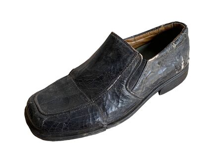 Close up retro old vintage leather shoe put on wooden table topの写真素材