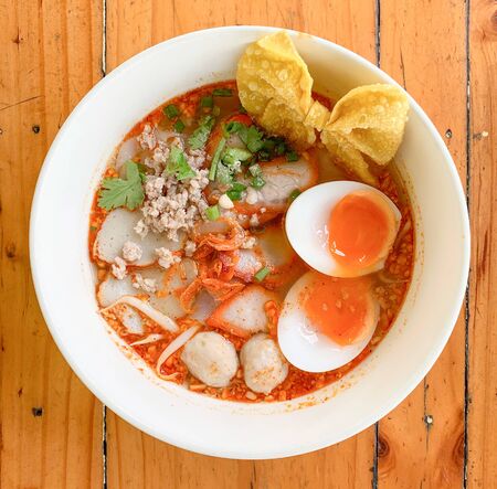Close up top view of noodle with egg put on wooden table topの写真素材