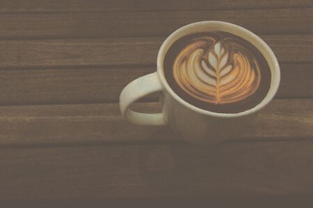 Latte in a white mugの写真素材