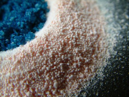 blue bath salts on soft pink bath saltsの写真素材