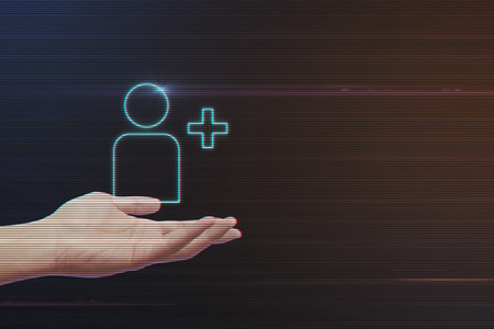 Human Hand Holding Add Friend Icon on Light Motion Background and Lens Flare - Digital 3d Effect Style Colorの写真素材
