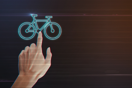 Human Hand Pressing Bicycle Icon on Light Motion Background and Lens Flare - Digital 3d Effect Style Colorの写真素材