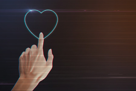 Human Hand Pressing Heart Icon on Light Motion Background and Lens Flare - Digital 3d Effect Style Colorの写真素材