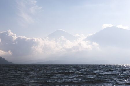Clouds on the mountains of Lake Atitlan, Guatemala.の写真素材