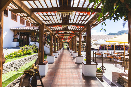 Large, beautiful covered patio in rural Guatemalan town. Sunny day setting.