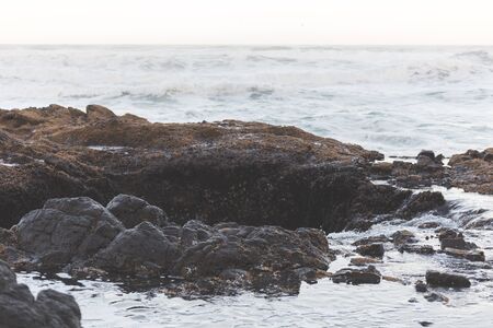 Ocean beach waves at Thor's Well in Cape Perpetua, Oregon Coast, USA.