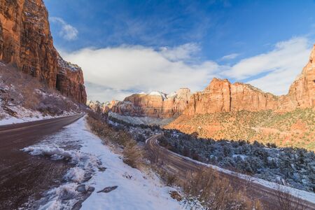 Snowy roads and blue skies at Zion National Park in southwest Utah, USA.の写真素材