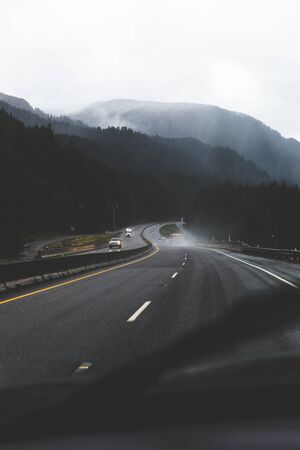 Curving highway in rainy weather along the Columbia River Gorge, Oregon, USA.の写真素材