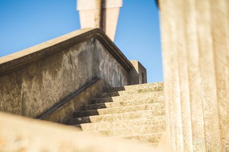 Concrete stairs and railings outside on a sunny day.の写真素材