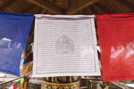 White, red, and blue Tibetan prayer flags.