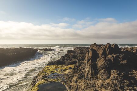 Rocky shore at the coast of the Pacific Ocean.の写真素材