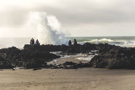 Waves impacting rocks on west coast of United States.の写真素材