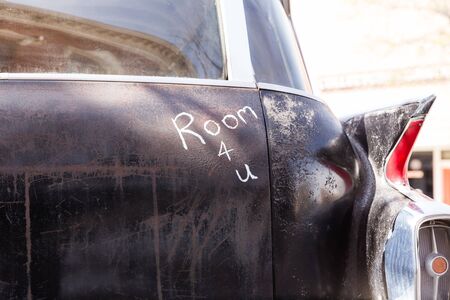 Classic black hearse vehicle with the words "Room 4 U" written on the back.の写真素材