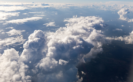Puffy clouds seen from an airplane.の写真素材