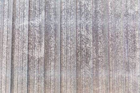 Texture detail on outer wall of metal building.の写真素材