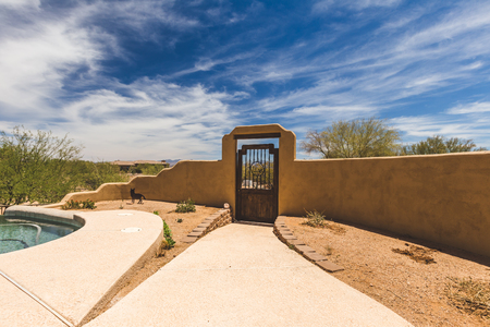 Stucco architecture in the back yard of a desert home in Arizona, USA.の写真素材