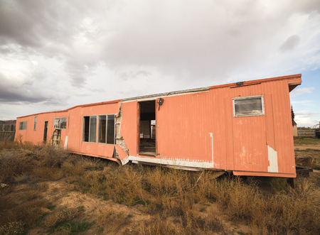 Abandoned mobile home or trailer home in a rural desert landscape near Fredonia, Arizona, USA.の写真素材