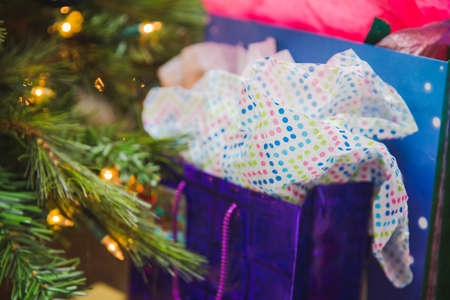 Christmas gifts under a tree. Gift has decorative paper.