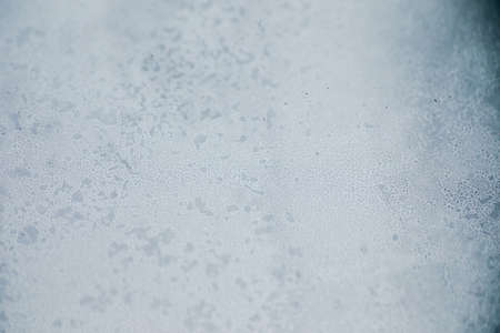 Abstract texture, grungy, gritty, dirty background. Texture captured by focusing closely on a dirty old window, using a macro lens.の写真素材