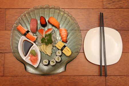 sushi and chopsticks with salty soy sauceの写真素材