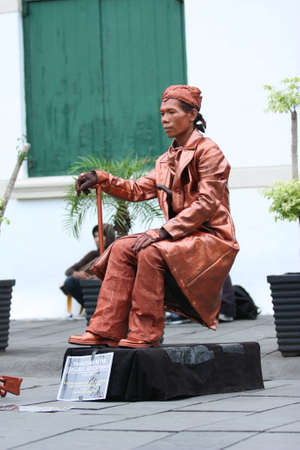 Jakarta, Indonesia. November 9, 2013: Attraction of the Human Statue as a general Soedirman (Indonesian hero) in the old city of Jakarta is an exhibition of street artists in the old city area.のeditorial素材