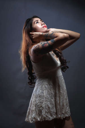 Beautiful Tatto girl posing beauty and expression face with fashionableの写真素材
