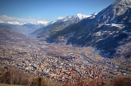 High view of Aosta city and its valley in the Alps, northern Italyの写真素材