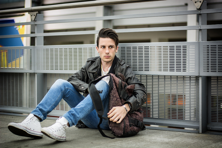 Attractive young man inside modern building, station or airportの写真素材