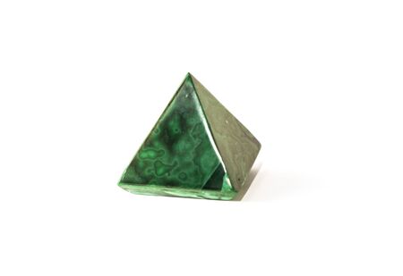 Beautiful malachite pyramid, cut mineral on white background, isolatedの写真素材