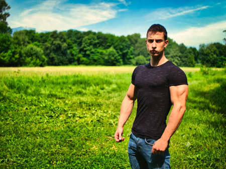 Handsome Muscular Hunk Man Outdoor in Parkの写真素材