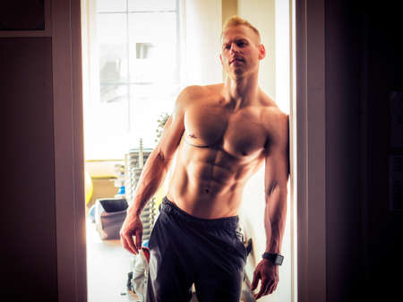 Handsome young man in gymの写真素材