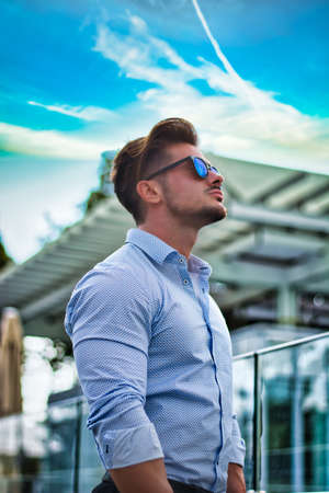 One handsome elegant man in city setting wearing shirtの写真素材