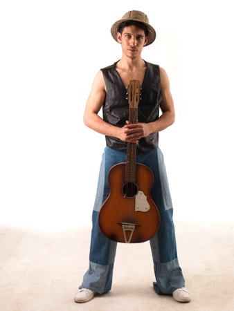 Young man with acoustic guitar, isolated on whiteの写真素材