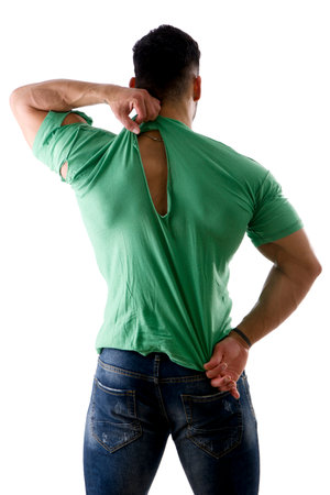 Muscular ale in jeans and torn t-shirt showing bicep and doing sad expressionの写真素材