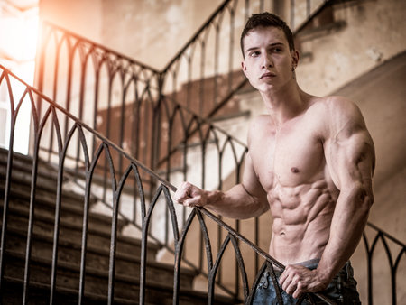 Topless attractive muscular young man in jeansの写真素材