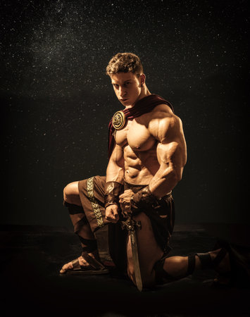Muscular man posing in roman gladiator costumeの写真素材