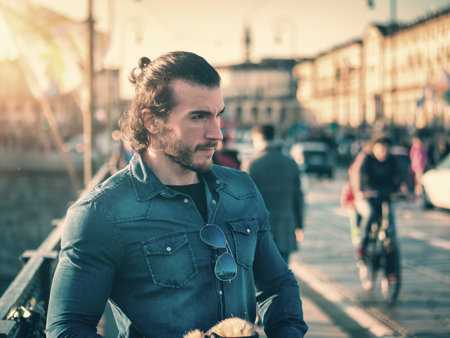 One handsome young man in urban setting in European cityの写真素材