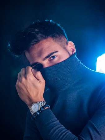 Handsome elegant young man with turtleneck sweater