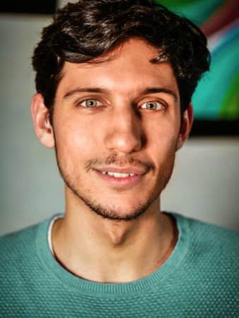 Happy handsome young man looking at cameraの写真素材