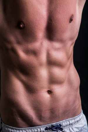 Photo of a shirtless muscular man
