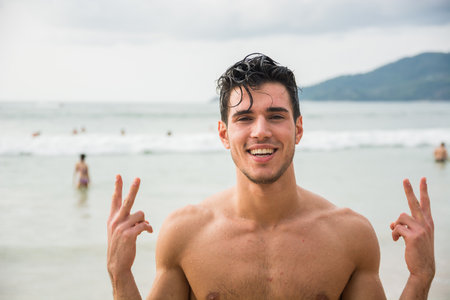 Photo of a man enjoying the serenity of the beach, feeling free and at peace